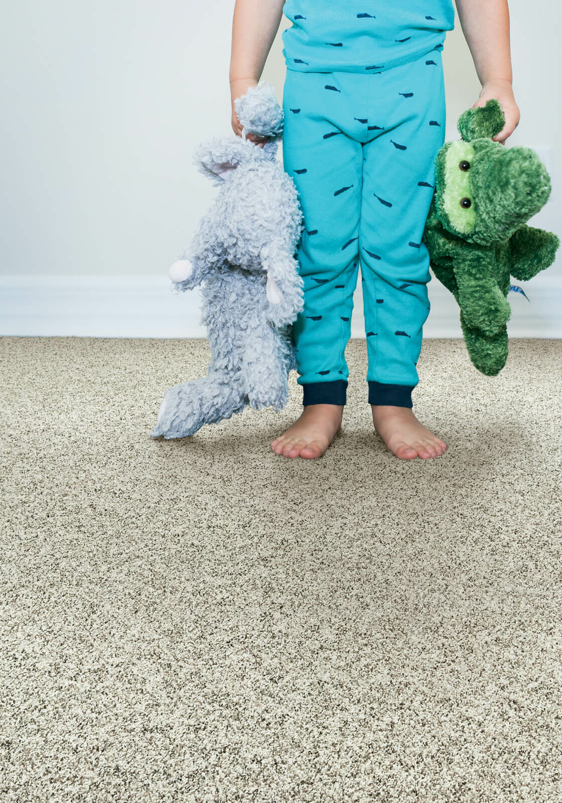 Kid with toys standing on soft carpet | Floor Magic