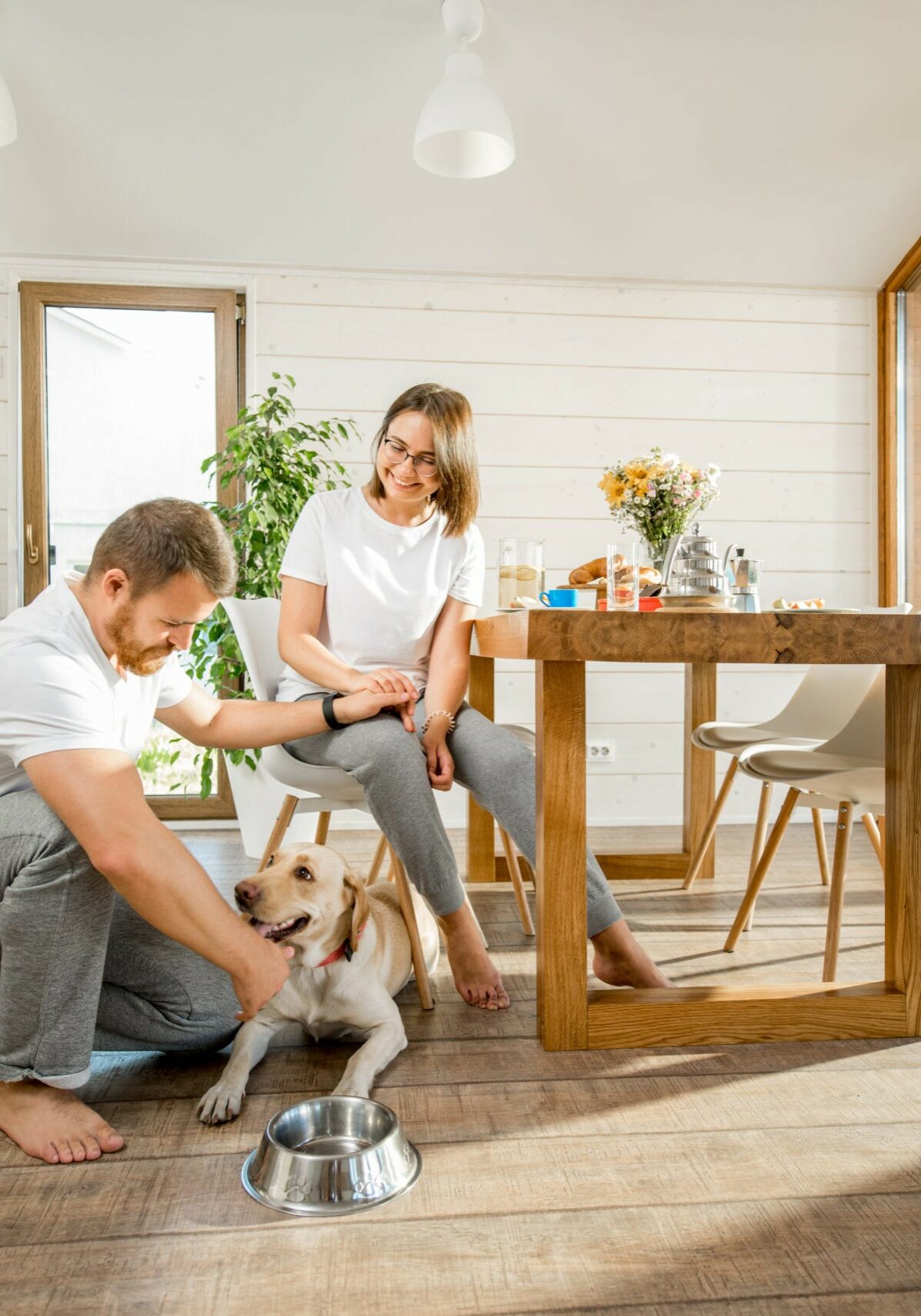 Happy couple with dog at home | Floor Magic
